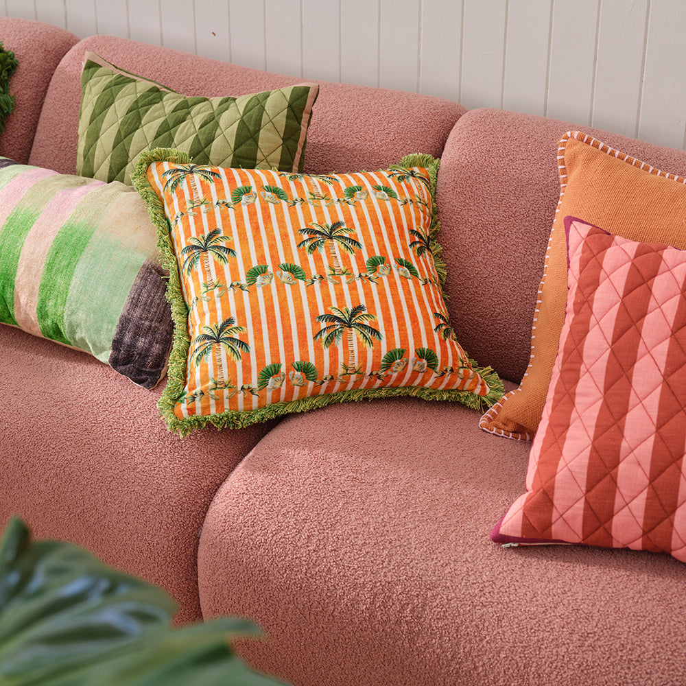 Palm Royal Multi Colour Cushion in a living room setting, front view with vibrant colours