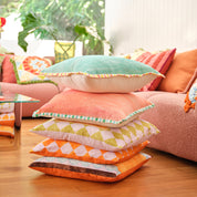 Valencia Cushion in mint hue on a living room setting, front view