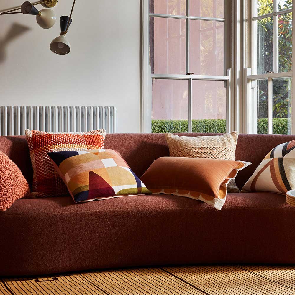 Sahara Neutral Velvet Cushion in lifestyle setting, geometric pattern on cotton slub fabric